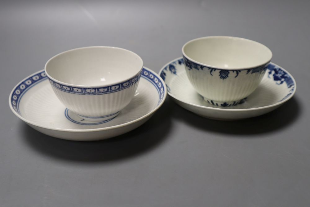 Two Worcester reeded teabowls and saucers, one with Dark Sprig Centre and the other with a border pattern, 12cm